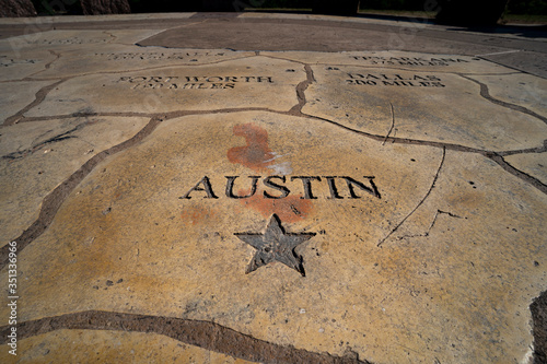 Texas map etched in stone. Austin and a star appear in the foreground