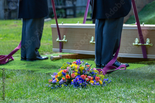 coffin and wreath at graveside