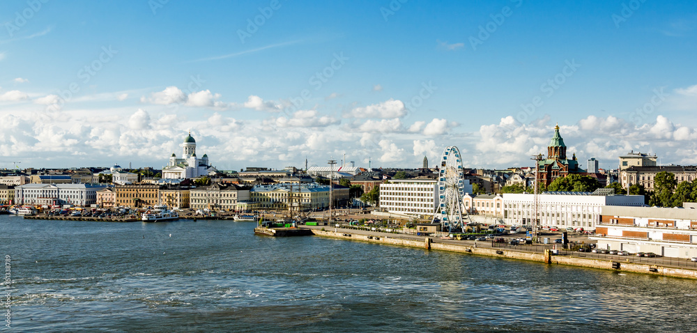 Panorama of the harbour in Helsinki with a view of the Cathedral and the Ferris wheel.