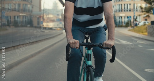 Fototapeta Naklejka Na Ścianę i Meble -  Young hipster man riding bike