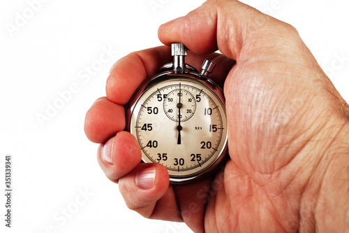 Hand of a sports coach with a stopwatch, white background, isolate, close-up