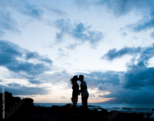 Couple kissing at Napili bay Maui