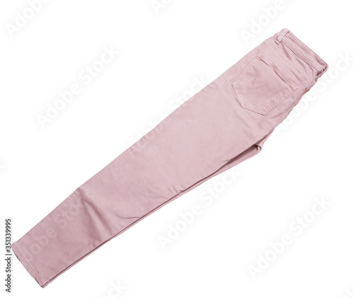 Female pants, light pink denim pants top view isolated on white background, folded slim pants