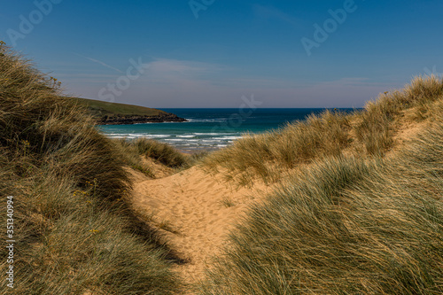 Fototapeta Naklejka Na Ścianę i Meble -  A view to the sea through the dunes at Crantock beach, Cornwall