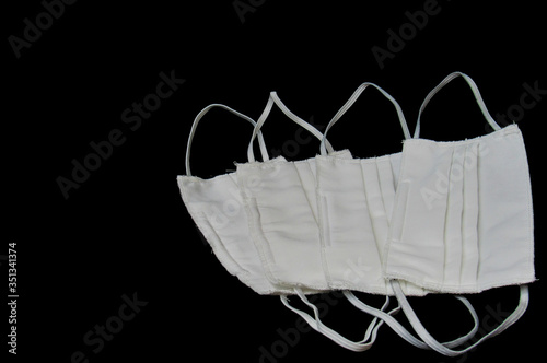white mask on a black background photo