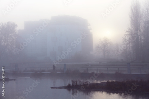 Foggy winter morning at urban riverside © Jonathan Stutz