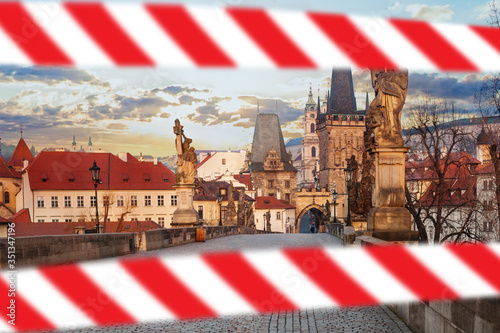 Empty Charles Bridge and Lesser Town Bridge Tower in Prague Czech Republic with warning tape