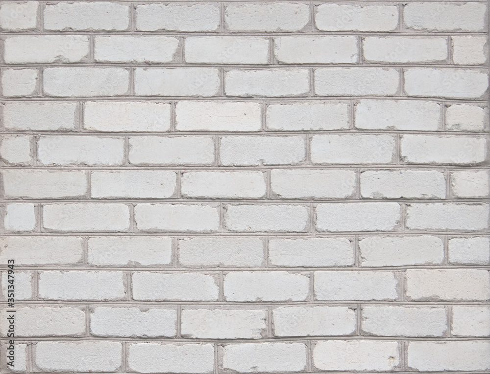 Texture of a white brick wall on an old house as a background Texture of a white brick wall on an old house as a background