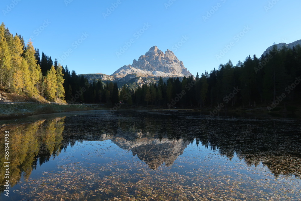Peaceful reflection of the mountain at the Lago d'Antorno in the Dolomites
