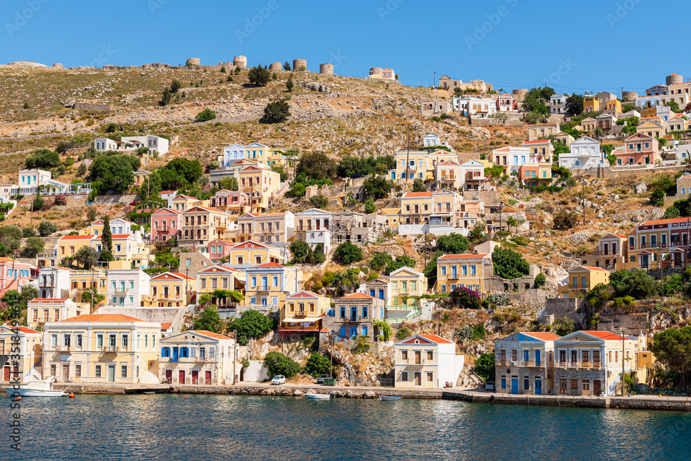 Colorful houses on the hillside of the island of Symi. Greece
