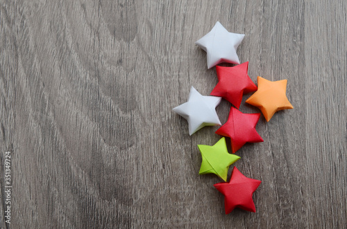 origami lucky paper stars on wooden