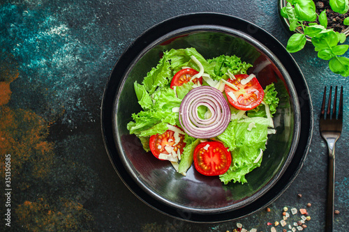 Healthy salad, leaves mix salad (mix micro greens, cucumber, tomato other ingredients) keto or paleo diet food background copy space 