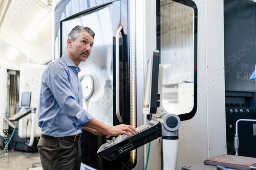 Marure man working on production foor in factory photo