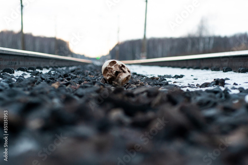 accident on the rails. human skull on the railroad tracks. human remains. terrible find.