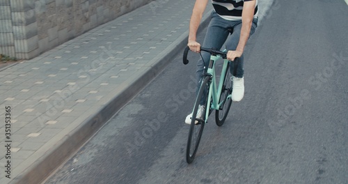 Fototapeta Naklejka Na Ścianę i Meble -  Young hipster man riding bike