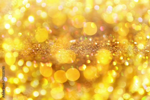 Gold glitter with bokeh effect as abstract background