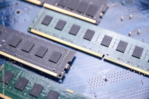 Computer memory RAM on motherboard background . Close up. system, main memory, random access memory, onboard, computer detail. Computer components . DDR3. DDR4. DDR5