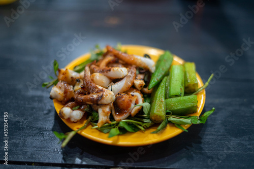 Exotic bizzare street food - grilled frog, lobster, octopus in Vietnam