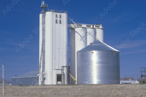 Grain silo co-op in KS with a blue sky in the background