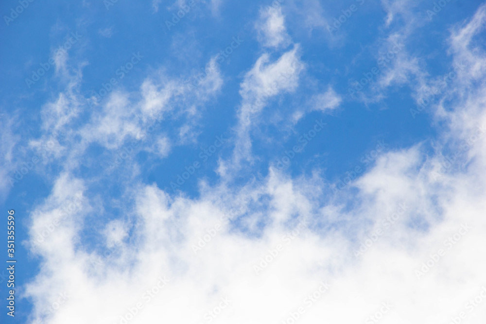 Blue sky with clouds. White cloud. Blue background
