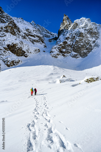Climber on the winter mountain landscape in the Polish and Slovak Tatra mountains.