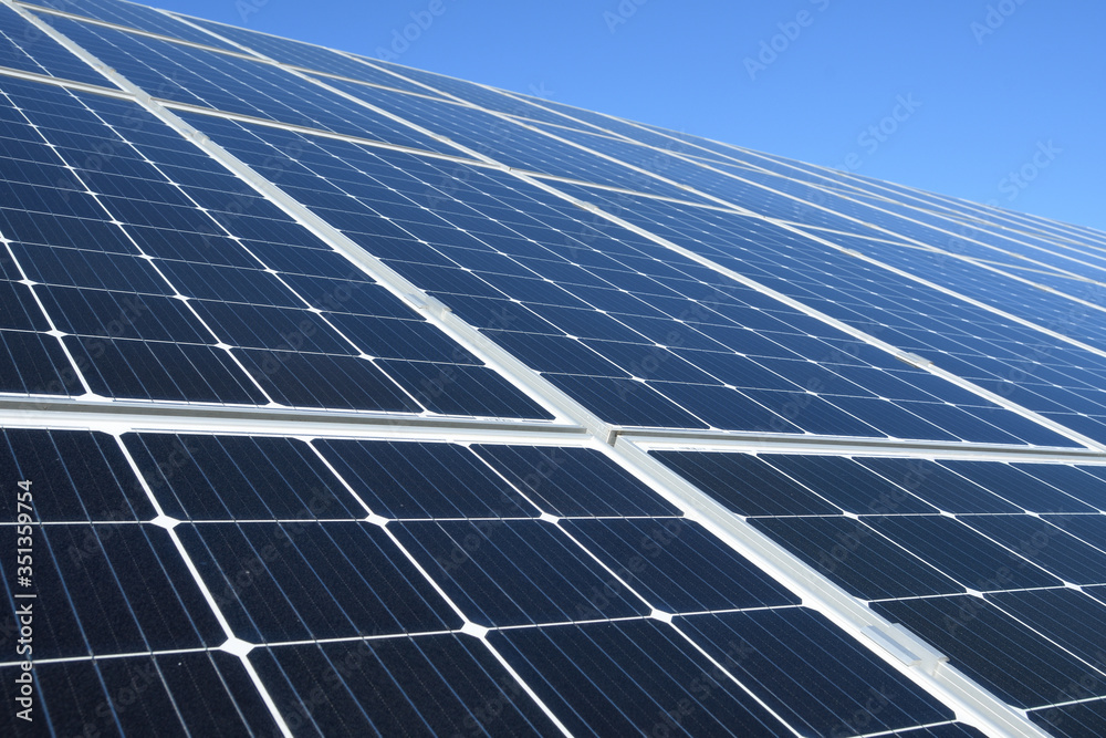 Solar panels against blue sky background.Against The Deep Blue Sky in suny weather Solar panels against blue sky background.Against The Deep Blue Sky in suny weather