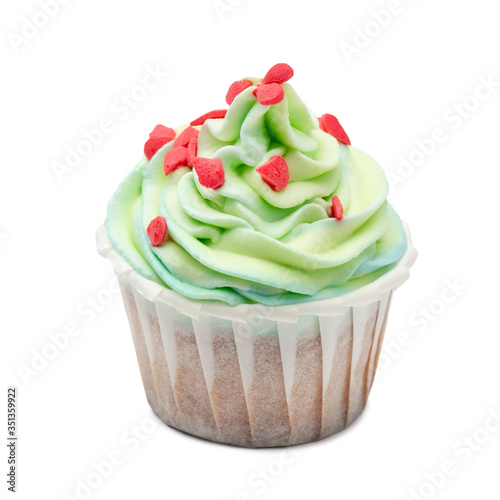 Mint cupcake with red decoration on white background. isotaled photo