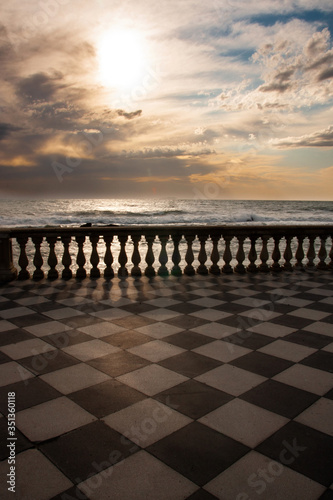 Sunset from Mascagni terrace in Livorno with stormy sea