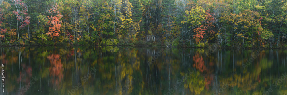 Fall foliage reflected in lake, Maine, New England, United States of America, North America Fall foliage reflected in lake, Maine, New England, United States of America, North America