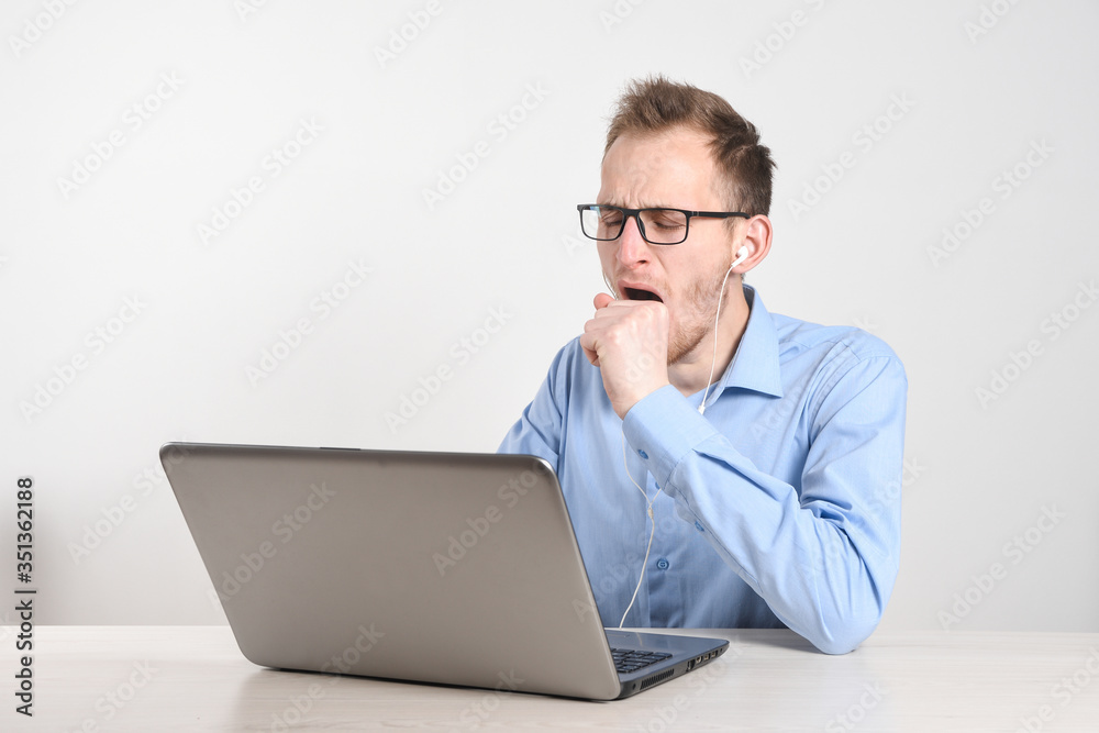 Man using laptop at home in living room. Mature businessman send email and working at home.Work at home. Typing on computer with paperworks and documents on table. Man using laptop at home in living room. Mature businessman send email and working at home.Work at home. Typing on computer with paperworks and documents on table.