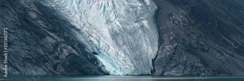 Panorama image of glacier fingers coming down to seashore, Nunavut and Northwest Territories, Canada, North America photo
