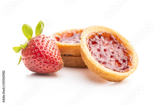 Sweet biscuits with strawberries jam and strawberries