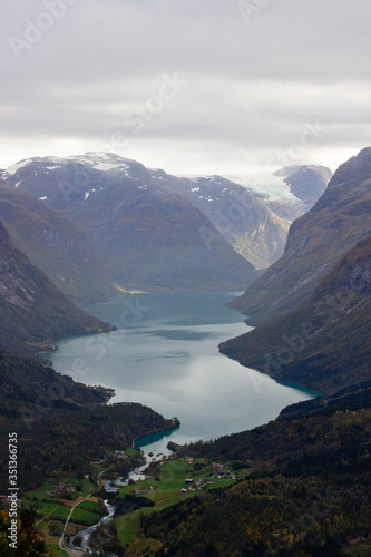 Scenic view of valley and nLovatnet near Via ferrata at Loen Norway with mountains in the background.norwegian october morning photo of scandinavian nature for printing on calendar wallpaper cover