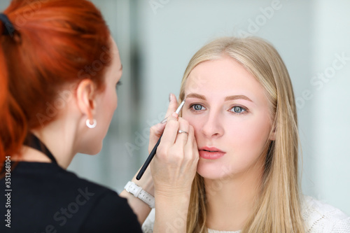 Pretty female preparing for party