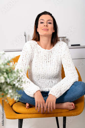 A beautiful woman relaxing at home