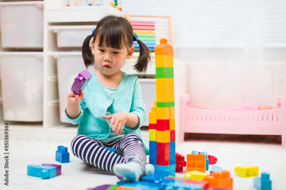 toddler girl playing creative toy blocks at home toddler girl playing creative toy blocks at home
