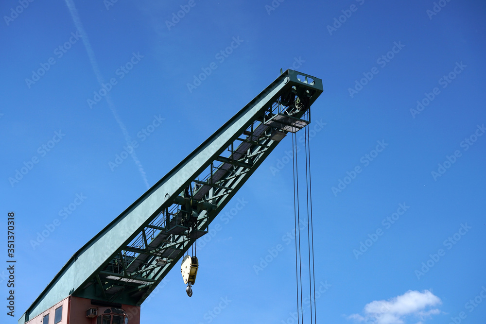 Crane in an industrial port on the Danube in Bavaria photographed in spring