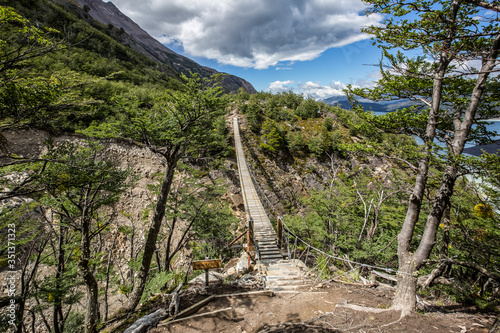 Chile, Región de Magallanes y de la Antártica Chilena, Ultima Esperanza, Torres del Paine, O-Circuit-Wanderung 130km, Wanderung zum drittletzten Camp Glacier Grey, Hängebrücke photo