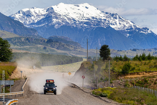 Tourist driving an off road vehicle at Carretera Austral Route - Coyhaique, Aysén, Chile photo