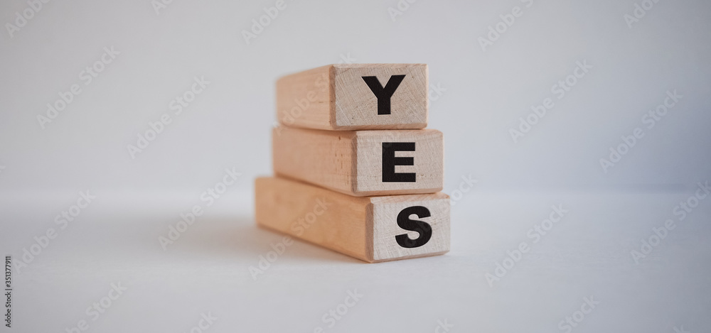 inscription yes on wooden cubes on white background inscription yes on wooden cubes on white background