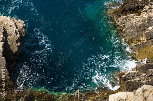 rocky cliff above the blue sea