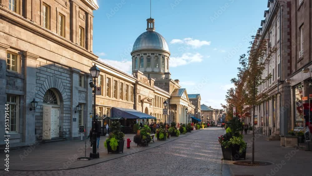 Zoom out tmelapse view of historical landmark Bonsecours Market in the heart of Old Montreal on a sunny day in Montreal, Quebec, Canada.