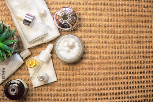 Facial care products amid bamboo mat photo