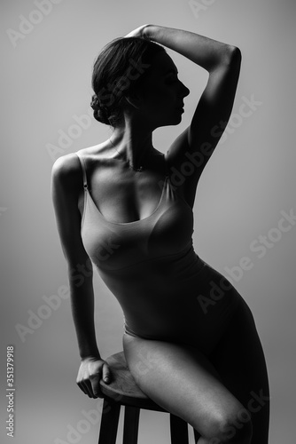 Black and white fashion art studio portrait of beautiful elegant woman. Elegant ballet style