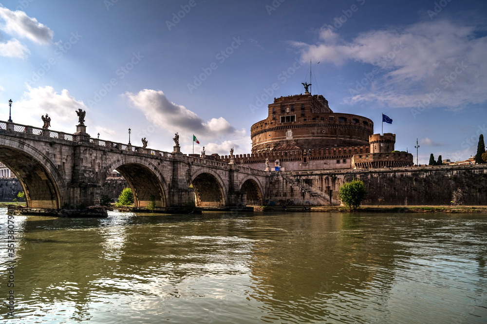 Rome, Italy: in the background Sant'Angelo Castel, on the left the Sant'angelo bridge, in close up the Tevere river.