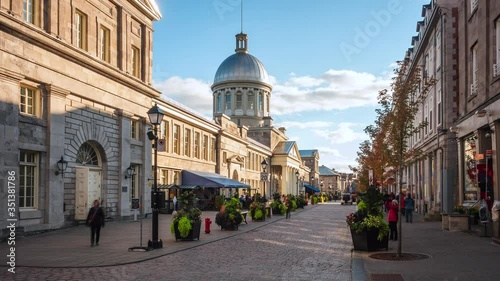 Zoom in timelapse view of historical landmark Bonsecours Market in the heart of Old Montreal on a sunny day in Montreal, Quebec, Canada. photo