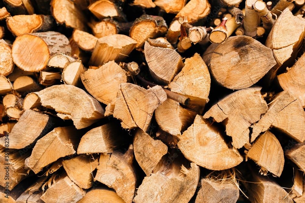 Closeup of chopped firewood in a stack ready for burning. Closeup of chopped firewood in a stack ready for burning.