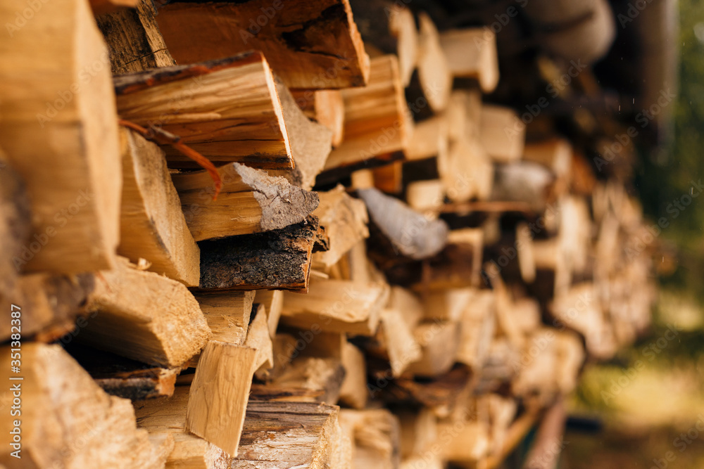 Closeup of chopped firewood in a stack ready for burning. Closeup of chopped firewood in a stack ready for burning.