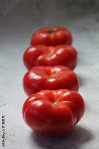 red tomatoes on a black background
