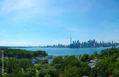 Photography Toronto Central Islands and Ward's Island Park beach, Ontario, Canada, aerial view from top at sunny greenery coast with boats and downtown gta at summer